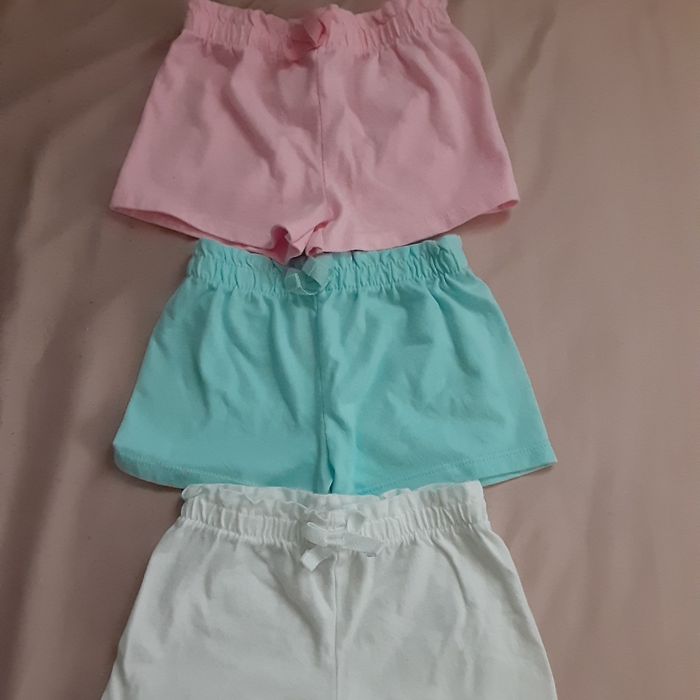 3 blue, pink, and white baby shorts
